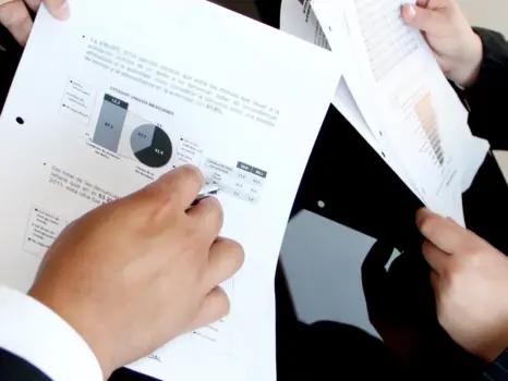 a group of people holding papers